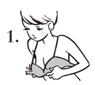 1.肩ストラップを両肩に通し、体を前に倒したままバストをカップに合わせ、ホックを留めます。